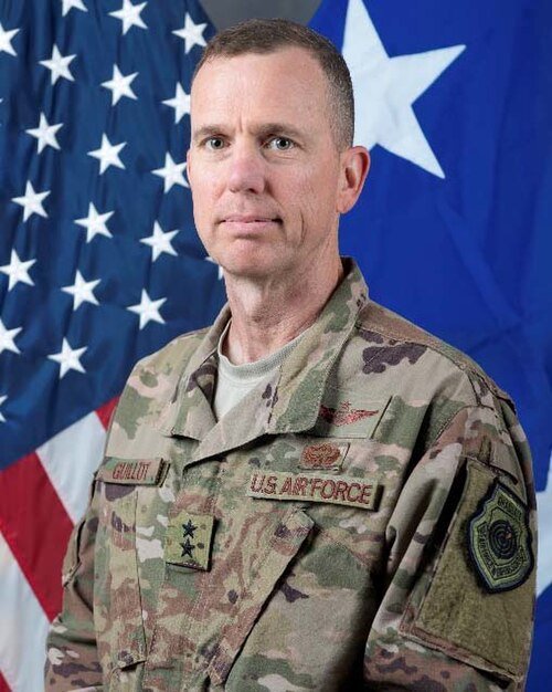 Portrait van Jean-Baptiste André Guillot in donkere, formele kleding.