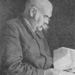 Stijlvol Johannes Böttner herenhorloge met zwart leren band en zilveren wijzerplaat.