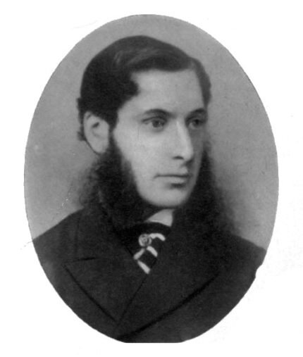 Portrait of John Gould Veitch (1839-1870) in classic attire surrounded by lush plants.